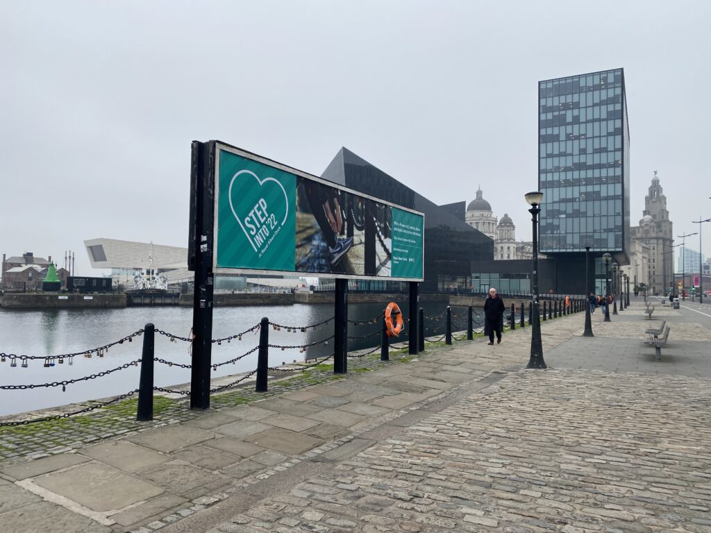 a billboard by Liverpool docks