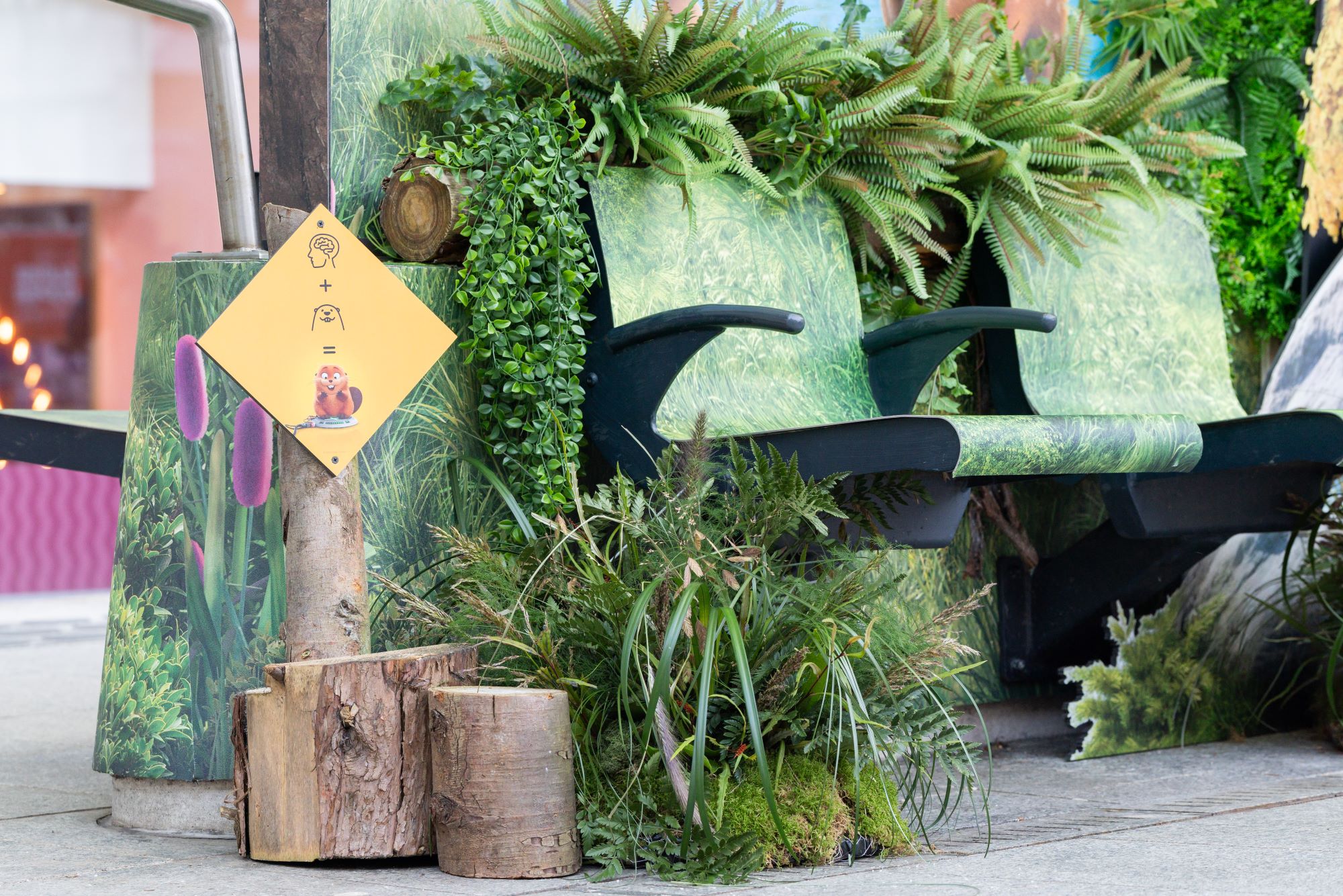 Textured vinyl wrap applied to tram stop seating for experiential advertising campaign in Manchester