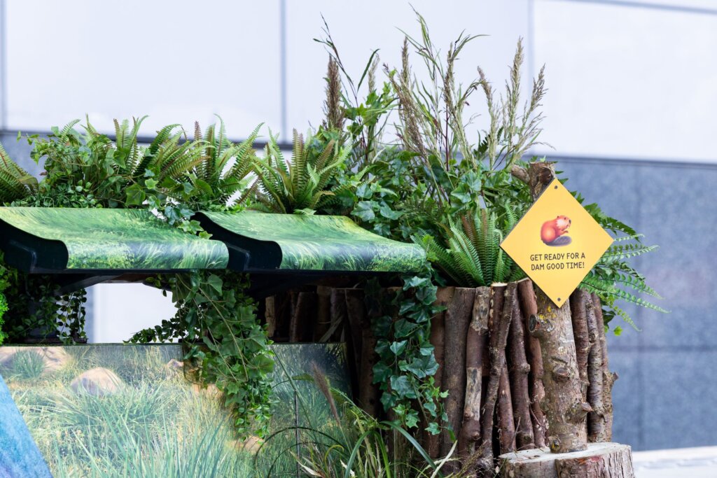 Textured vinyl wrap applied to tram stop seating for experiential advertising campaign in Manchester