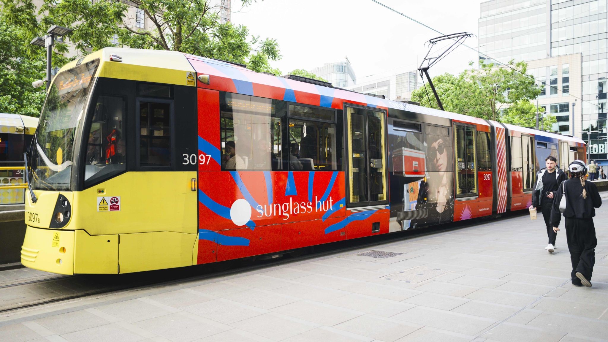commercial tram wrapped by vinyline in centre of manchester