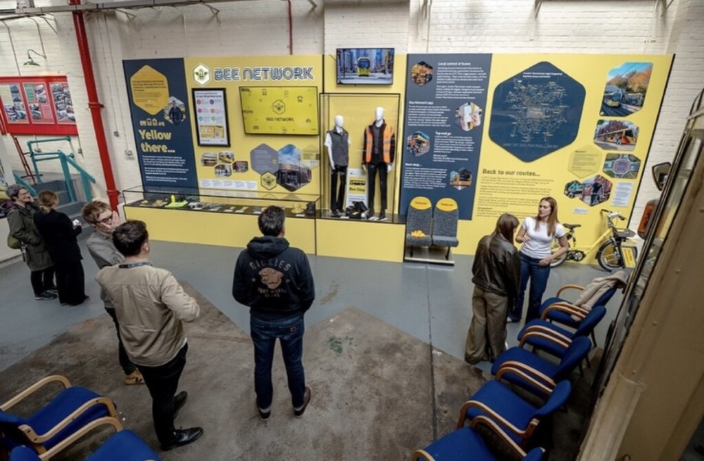 Bee Network exhibition display at Manchester Transport Museum featuring illuminated graphics, interactive displays, acrylic showcases and transport heritage exhibits.