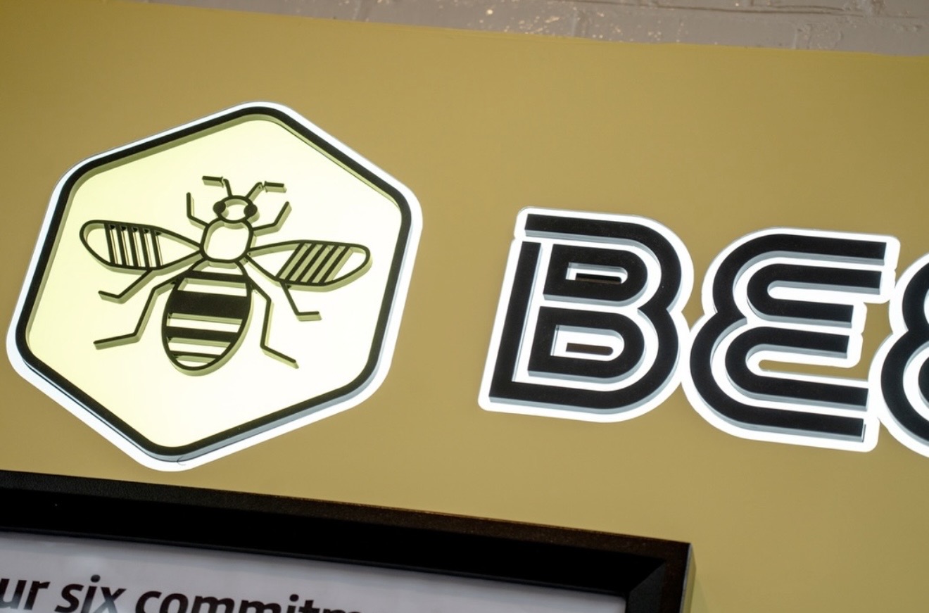 Close-up of illuminated Bee Network push-through lettering.