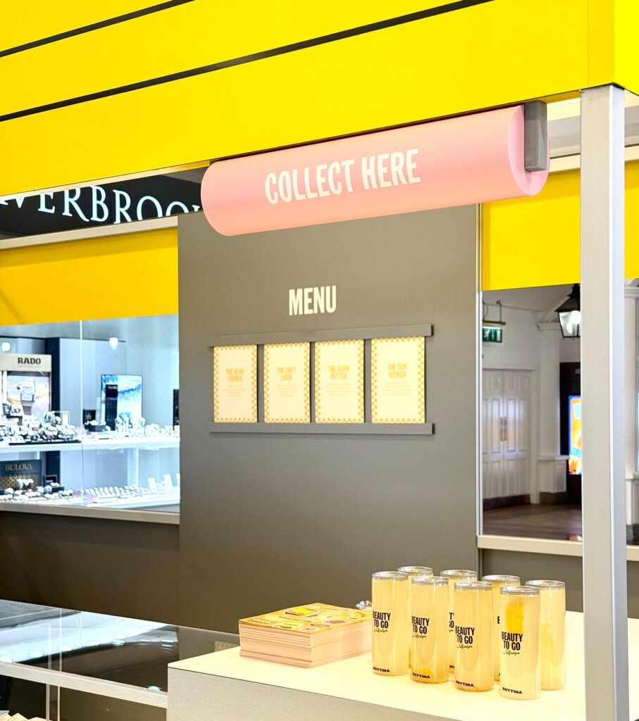 Aluminium framed retail kiosk with acrylic lettering